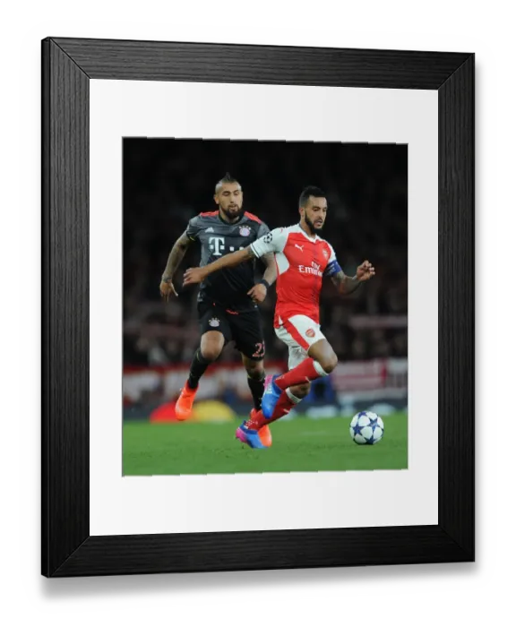 Framed Print : Theo Walcott vs. Arturo Vidal: A Battle in the Arsenal vs. Bayern Munich UEFA Champions League Clash Framed Print : Theo Walcott vs. Arturo Vidal: A Battle in the Arsenal vs. Bayern Munich UEFA Champions League Clash