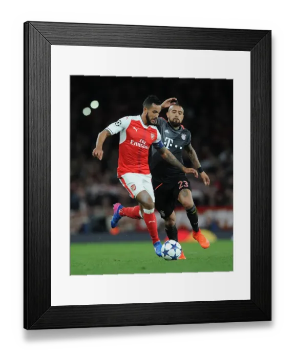 Framed Print : Arsenal's Theo Walcott Clashes with Bayern Munich's Arturo Vidal in UEFA Champions League Showdown Framed Print : Arsenal's Theo Walcott Clashes with Bayern Munich's Arturo Vidal in UEFA Champions League Showdown