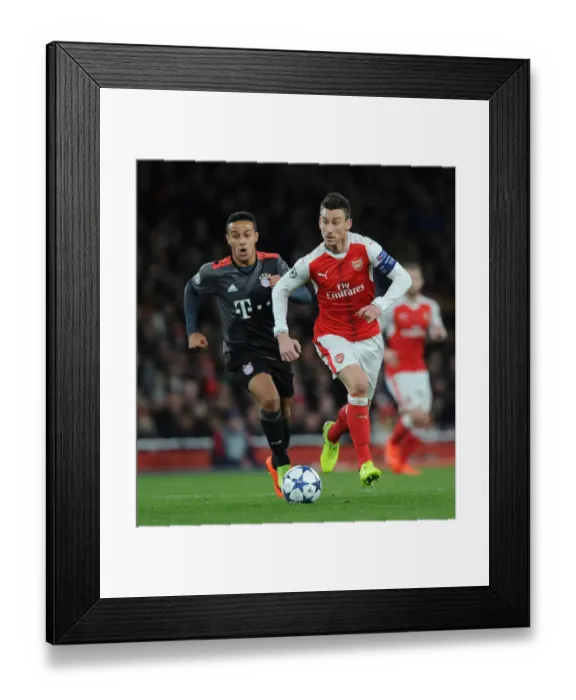 Framed Print : Arsenal vs. Bayern Munich: Koscielny vs. Thiago in UEFA Champions League Showdown Framed Print : Arsenal vs. Bayern Munich: Koscielny vs. Thiago in UEFA Champions League Showdown