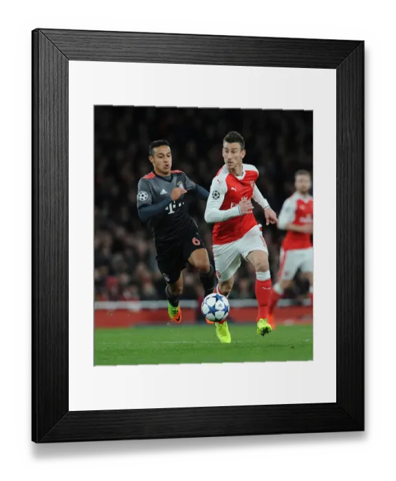Framed Print : Champions Clash: Koscielny vs Thiago - Arsenal vs Bayern Munich, Champions League Battle Framed Print : Champions Clash: Koscielny vs Thiago - Arsenal vs Bayern Munich, Champions League Battle