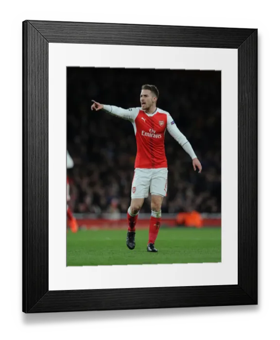 Framed Print : Arsenal's Aaron Ramsey Faces Off Against Bayern Munchen in Champions League Showdown