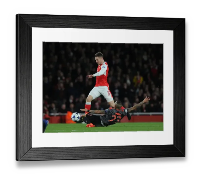 Framed Print : Arsenal vs. Bayern Munich: Aaron Ramsey vs. Arturo Vidal Clash in Champions League Showdown