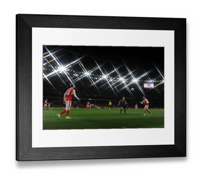 Framed Print : Monreal Throws to Sanchez: Arsenal vs. Bayern Munich in Champions League Showdown (2016-17)