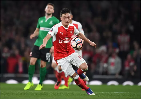 Mesut Ozil in Action: Arsenal's Star Performance at Emirates FA Cup Quarter-Final vs. Lincoln City