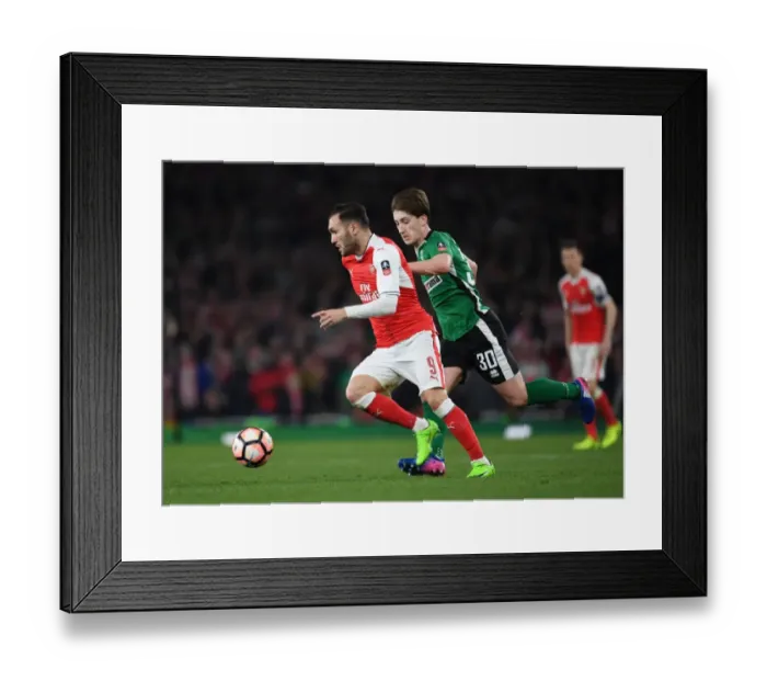 Framed Print : Arsenal's Lucas Perez Outmaneuvers Lincoln's Alex Woodyard in FA Cup Quarter-Final Showdown