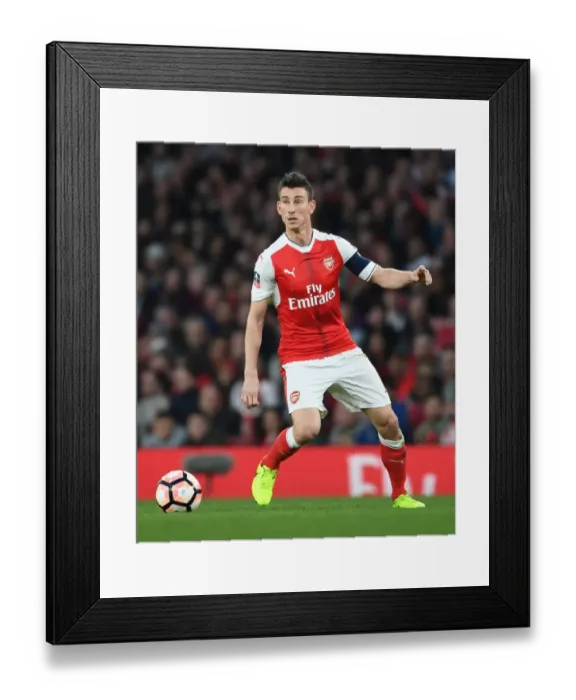 Framed Print : Arsenal's Koscielny Focused in FA Cup Quarter-Final Against Lincoln City Framed Print : Arsenal's Koscielny Focused in FA Cup Quarter-Final Against Lincoln City