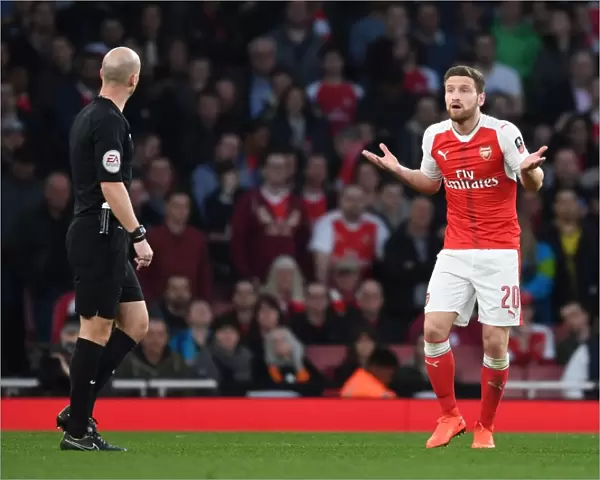 Mustafi's Dispute with Referee Taylor: Arsenal vs. Lincoln City FA Cup Quarter-Final