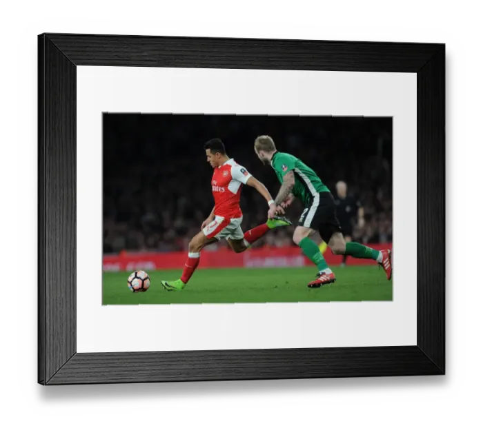 Framed Print : Arsenal's Alexis Sanchez Faces Off Against Lincoln City's Bradley Wood in FA Cup Quarter-Final Showdown Framed Print : Arsenal's Alexis Sanchez Faces Off Against Lincoln City's Bradley Wood in FA Cup Quarter-Final Showdown