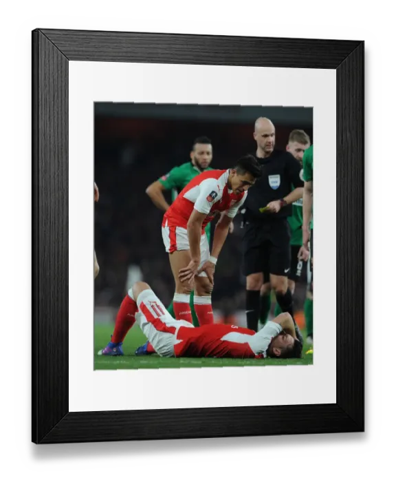 Framed Print : Arsenal's Sanchez and Ozil: A Moment of Support in FA Cup Quarter-Final Framed Print : Arsenal's Sanchez and Ozil: A Moment of Support in FA Cup Quarter-Final