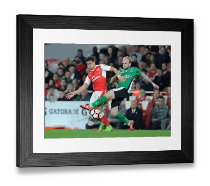 Framed Print : Arsenal's Alexis Sanchez vs. Lincoln's Bradley Wood: A FA Cup Quarter-Final Battle