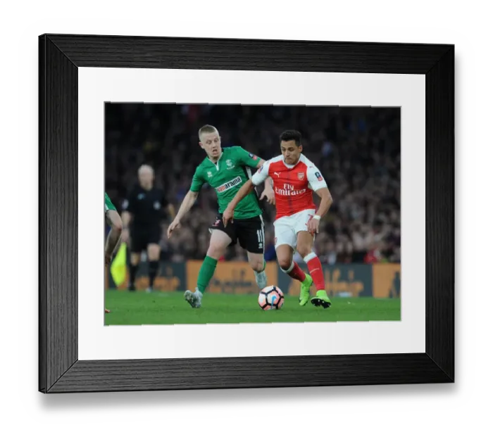 Framed Print : Arsenal's Alexis Sanchez Faces Off Against Lincoln's Terry Hawkridge in FA Cup Quarter-Final Showdown Framed Print : Arsenal's Alexis Sanchez Faces Off Against Lincoln's Terry Hawkridge in FA Cup Quarter-Final Showdown