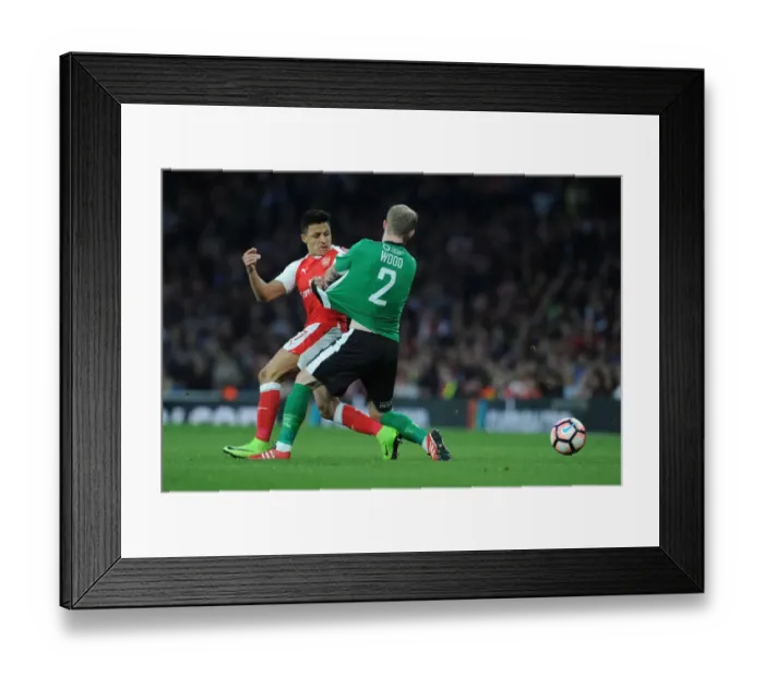 Framed Print : Arsenal's Alexis Sanchez Clashes with Lincoln's Bradley Wood in FA Cup Quarter-Final