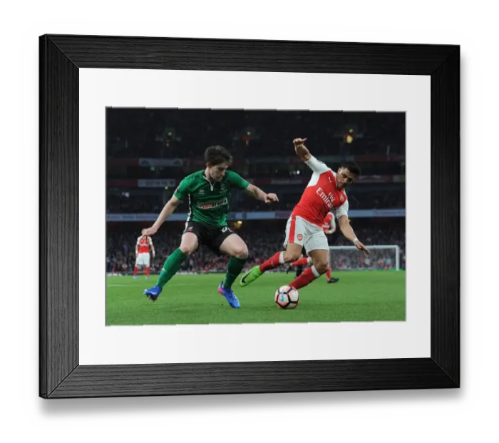 Framed Print : Arsenal's Alexis Sanchez vs. Lincoln City's Alex Woodyard: A FA Cup Quarter-Final Battle Framed Print : Arsenal's Alexis Sanchez vs. Lincoln City's Alex Woodyard: A FA Cup Quarter-Final Battle