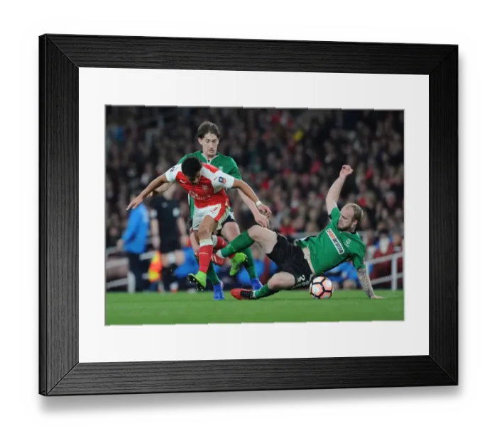 Framed Print : Arsenal's Alexis Sanchez Outmaneuvers Lincoln City Defenders during The Emirates FA Cup Quarter-Final Framed Print : Arsenal's Alexis Sanchez Outmaneuvers Lincoln City Defenders during The Emirates FA Cup Quarter-Final