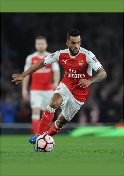 Theo Walcott in Action: Arsenal's Exciting Quarter-Final Clash vs. Lincoln City