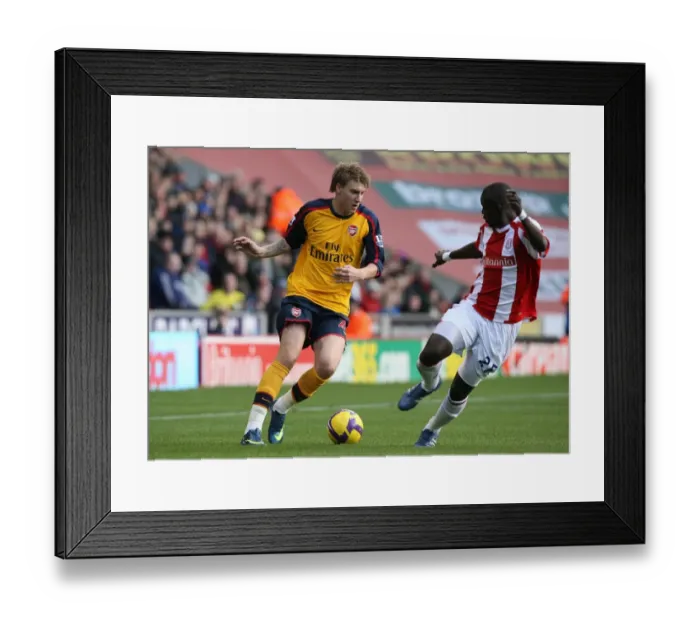 Framed Print : Bendtner Scores Double: Arsenal Edge Past Stoke 2-1 in Premier League Clash