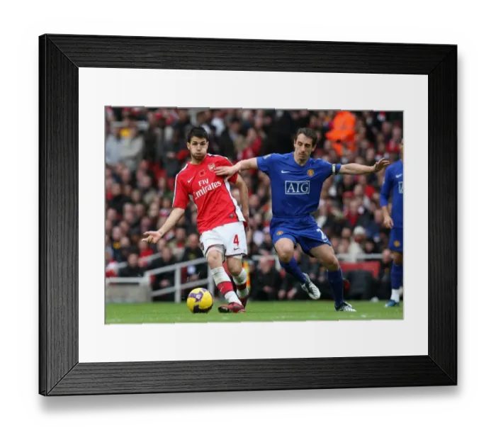 Framed Print : Clash of Stars: Fabregas vs. Neville in Arsenal's 2-1 Victory over Manchester United