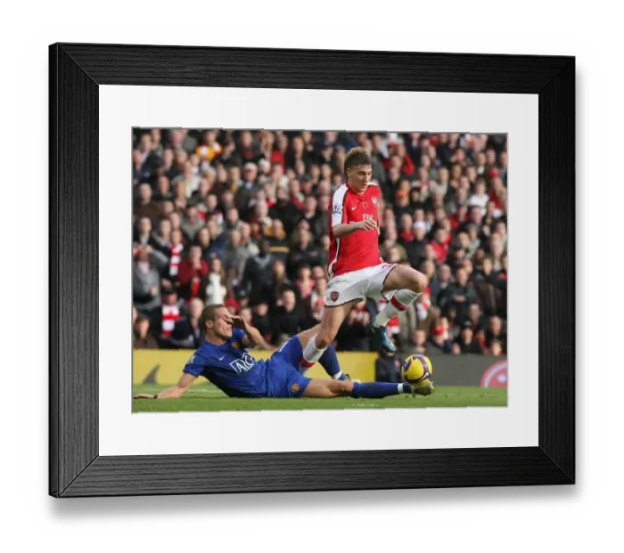 Framed Print : Bendtner vs Vidic: Arsenal's Edge over Manchester United in the 2008 Premier League Clash Framed Print : Bendtner vs Vidic: Arsenal's Edge over Manchester United in the 2008 Premier League Clash