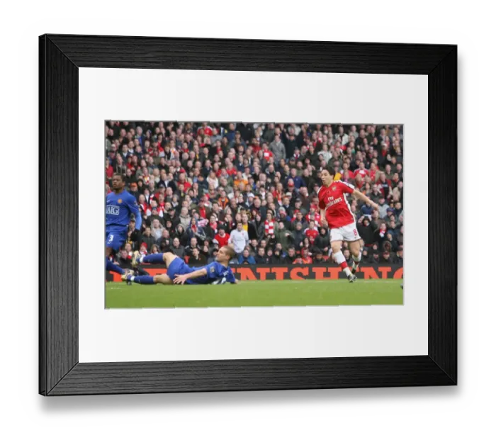 Framed Print : Samir Nasri shoots past Edwin van Der Sar to score Framed Print : Samir Nasri shoots past Edwin van Der Sar to score