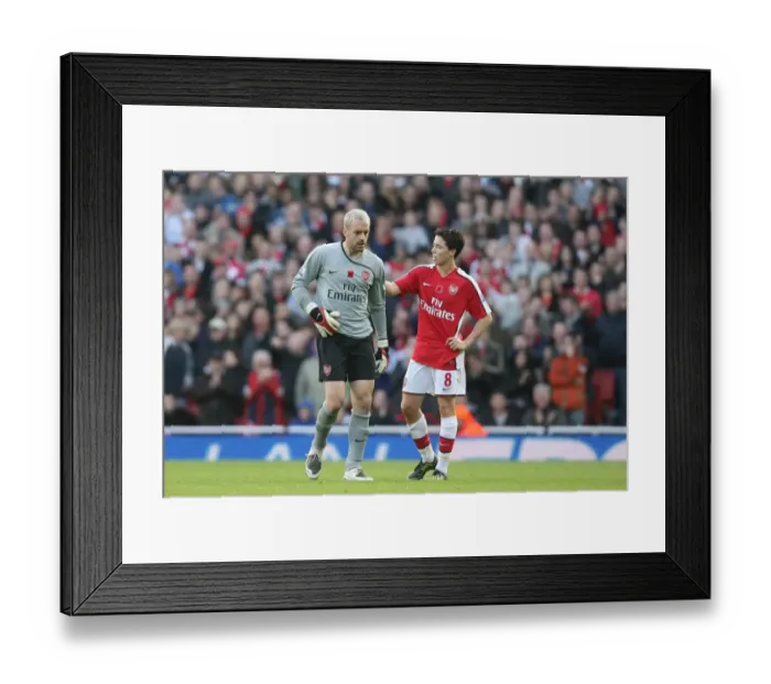 Framed Print : Injured Arsenal Goalkeeper Almunia Exits Field Against Manchester United