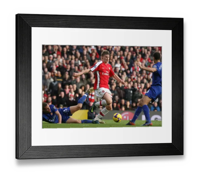 Framed Print : Bendtner's Victory: Arsenal's 2-1 Triumph Over Manchester United's Vidic and Ferdinand (2008) Framed Print : Bendtner's Victory: Arsenal's 2-1 Triumph Over Manchester United's Vidic and Ferdinand (2008)