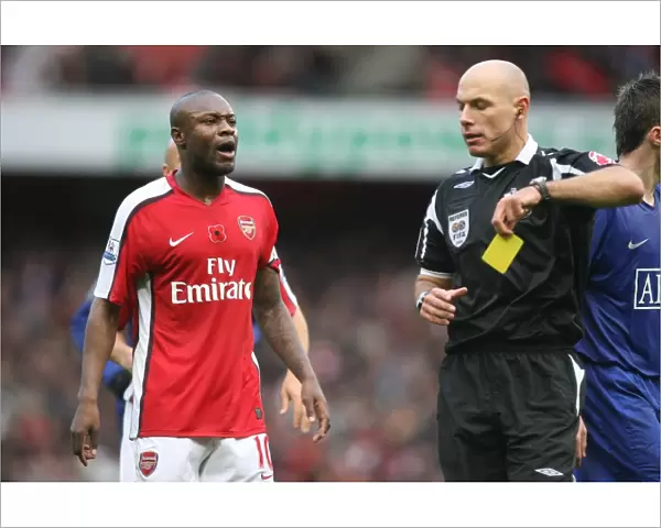 William Gallas (Arsenal) talks with referee Howard Webb