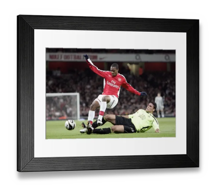 Framed Print : Arsenal Triumphs Over Wigan Athletic 3-0 in Carling Cup: Gavin Hoyte and Amr Zaki Face Off