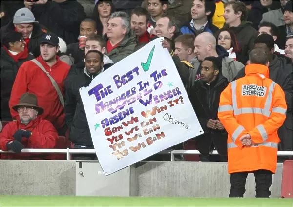 Arsenal fans show a flag in support of Arsene Wenger