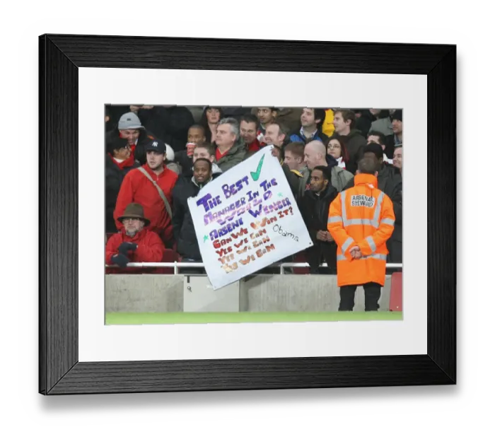 Framed Print : Arsenal fans show a flag in support of Arsene Wenger Framed Print : Arsenal fans show a flag in support of Arsene Wenger