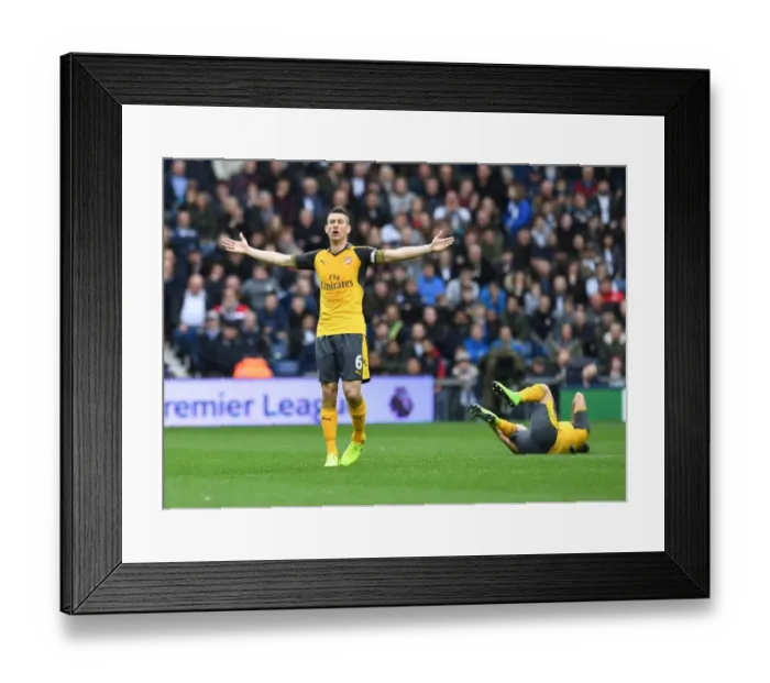 Framed Print : Laurent Koscielny Focuses in Arsenal's Premier League Clash Against West Bromwich Albion Framed Print : Laurent Koscielny Focuses in Arsenal's Premier League Clash Against West Bromwich Albion