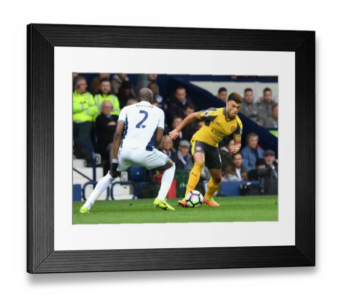 Framed Print : Arsenal's Alex Oxlade-Chamberlain Faces Off Against Allan Nyom in Premier League Clash
