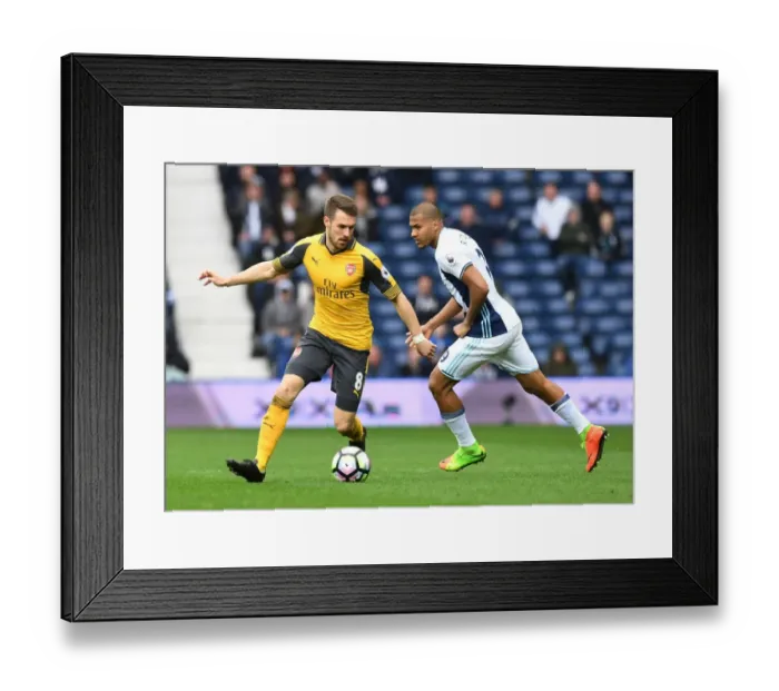 Framed Print : Arsenal's Aaron Ramsey Outmaneuvers West Brom's Solomon Rondon