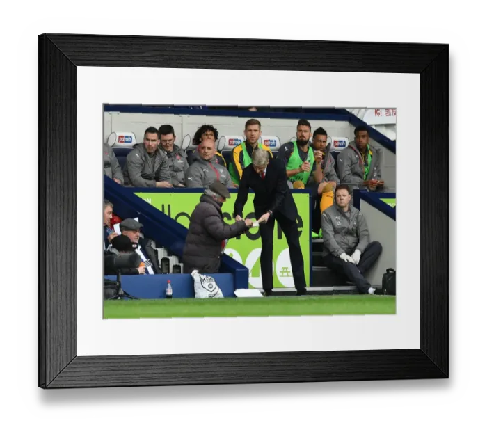 Framed Print : Arsene Wenger Signs Autograph for West Brom Fan during Arsenal's Premier League Match Framed Print : Arsene Wenger Signs Autograph for West Brom Fan during Arsenal's Premier League Match
