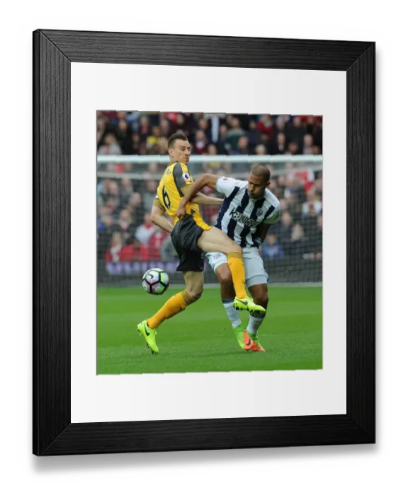 Framed Print : Clash at The Hawthorns: Koscielny vs Rondon in Premier League Battle Framed Print : Clash at The Hawthorns: Koscielny vs Rondon in Premier League Battle