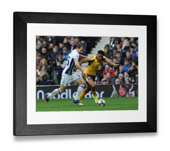 Framed Print : Arsenal's Alex Iwobi Faces Off Against West Bromwich Albion's Craig Dawson in Intense Premier League Clash