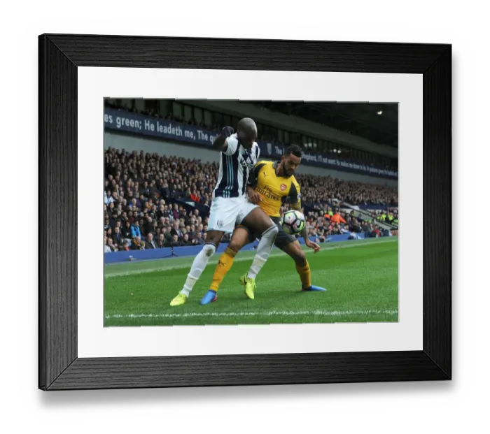 Framed Print : Theo Walcott vs Allan Nyom: Intense Battle in West Bromwich Albion vs Arsenal Premier League Clash