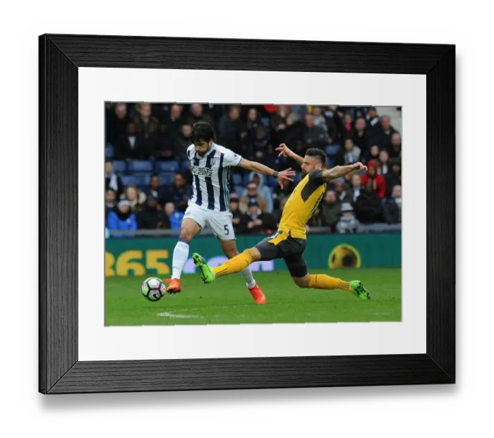 Framed Print : Clash at The Hawthorns: Giroud vs. Yacob in Arsenal's Premier League Battle with West Bromwich Albion Framed Print : Clash at The Hawthorns: Giroud vs. Yacob in Arsenal's Premier League Battle with West Bromwich Albion
