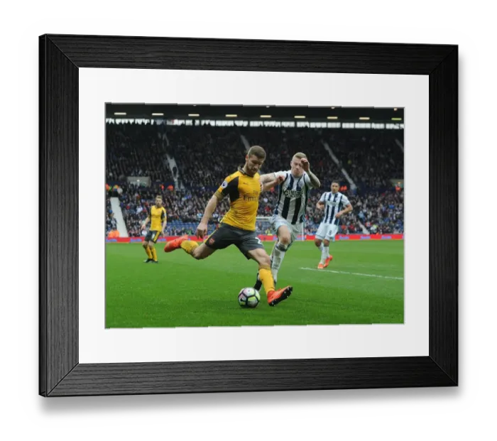Framed Print : Mustafi Faces Off Against McClean: Intense Moment from West Bromwich Albion vs. Arsenal (2016-17) Framed Print : Mustafi Faces Off Against McClean: Intense Moment from West Bromwich Albion vs. Arsenal (2016-17)