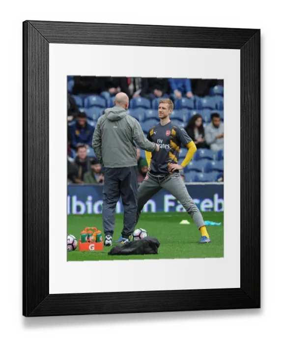 Framed Print : Mertesacker and Bould in Deep Discussion: Arsenal's Defensive Strategy Amidst West Brom's 3:1 Victory