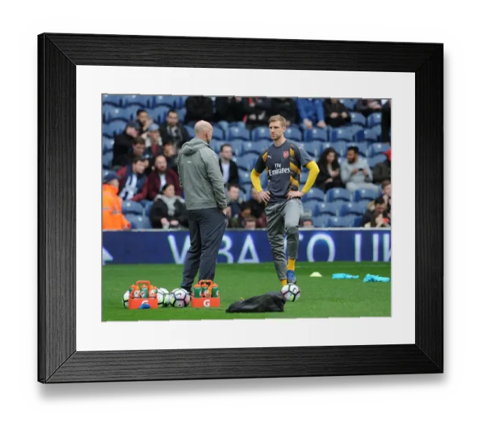 Framed Print : Per Mertesacker (Arsenal) chats to Steve Bould (Arsenal Assistant Manager)