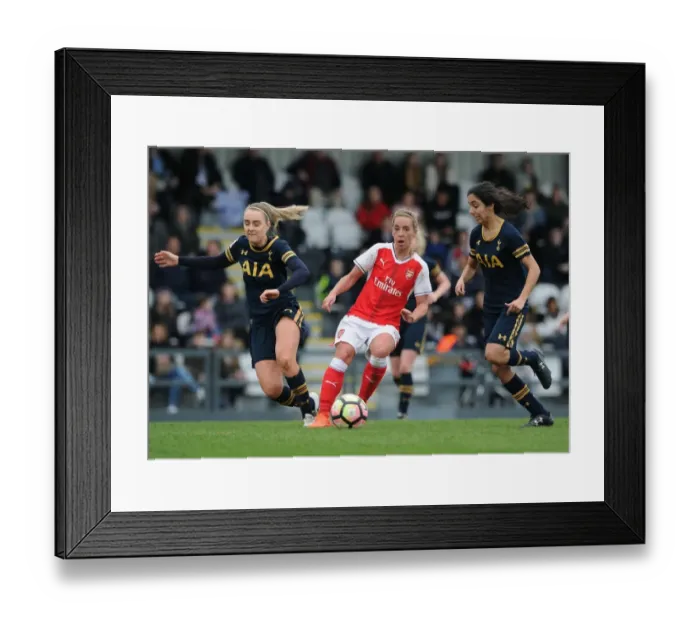 Framed Print : Intense FA Cup Clash: Nobbs vs. Green and Vio - Arsenal Ladies vs. Tottenham Hotspur Ladies: A Battle of Skills and Determination