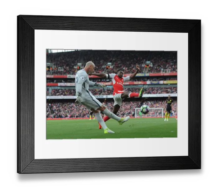 Framed Print : Arsenal's Danny Welbeck Closes In on Manchester City's Willy Caballero in Intense Premier League Clash
