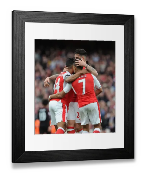 Framed Print : Theo Walcott celebrates scoring a goal for Arsenal with Alexis Sanchez and Granit Xhaka