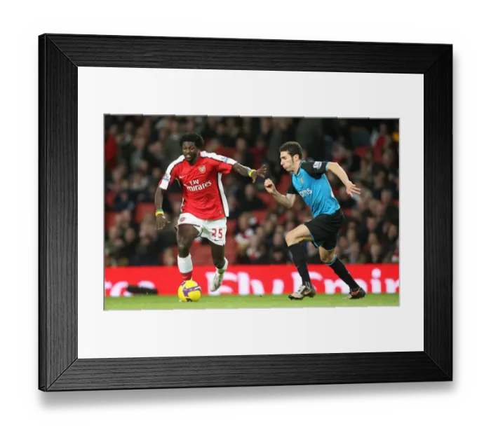 Framed Print : Emmanuel Adebayor (Arsenal) Carlos Cuellar (Aston Villa)