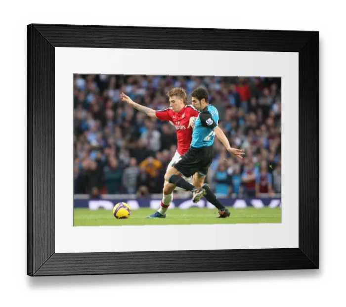 Framed Print : Nicklas Bendtner (Arsenal) Carlos Cuellar (Aston Villa) Framed Print : Nicklas Bendtner (Arsenal) Carlos Cuellar (Aston Villa)