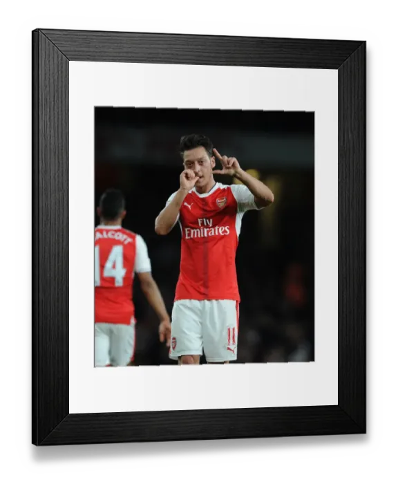Framed Print : Mesut Ozil's Thrilling Goal Celebration: Arsenal vs. West Ham United, Premier League 2016-17