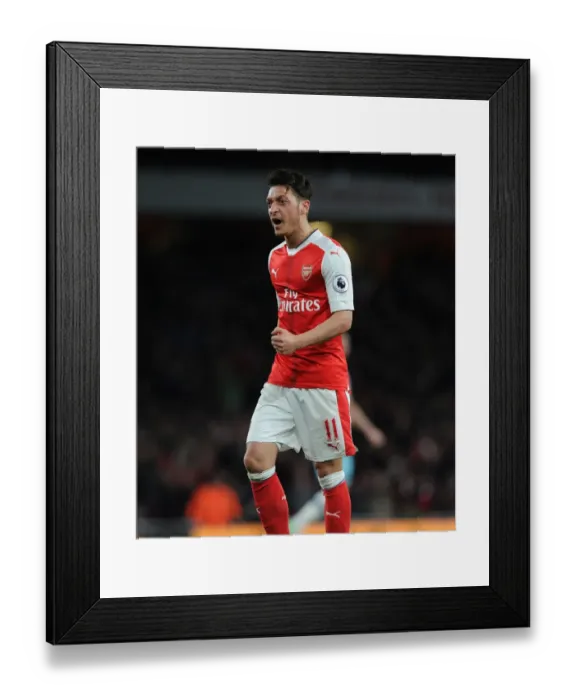 Framed Print : Mesut Ozil's Euphoric Goal Celebration: Arsenal vs. West Ham United, Premier League 2016-17 Framed Print : Mesut Ozil's Euphoric Goal Celebration: Arsenal vs. West Ham United, Premier League 2016-17
