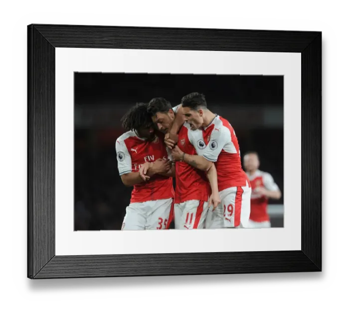 Framed Print : Arsenal's Ozil, Elneny, and Xhaka Celebrate Goal Against West Ham United Framed Print : Arsenal's Ozil, Elneny, and Xhaka Celebrate Goal Against West Ham United