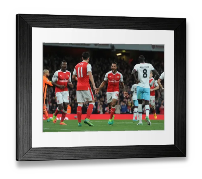 Framed Print : Arsenal's Triumph: Walcott, Welbeck, Ozil Celebrate Goals Against West Ham Framed Print : Arsenal's Triumph: Walcott, Welbeck, Ozil Celebrate Goals Against West Ham