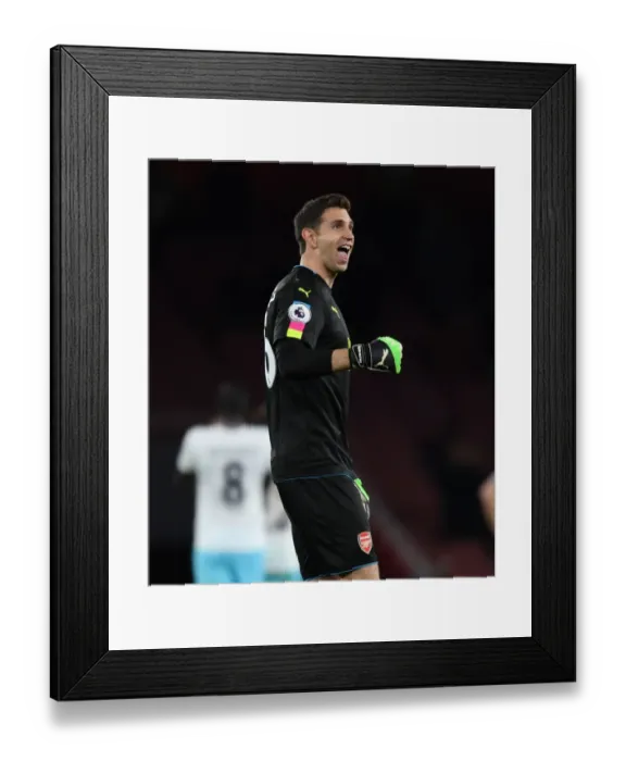 Framed Print : Emiliano Martinez: Arsenal's Steadfast Guardian in Arsenal v West Ham United